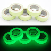 Glow in the dark sticker tape roll glowing in low light, used for home decor, stairs, and DIY crafts.

