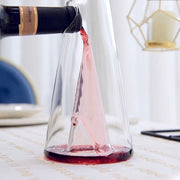 Elegant transparent wine decanter filled with red wine, used for decanting wine to enhance flavor and aroma.

