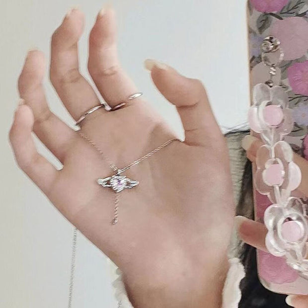 Elegant heart wings necklace featuring angel wings, symbolizing love, protection, and spiritual connection.