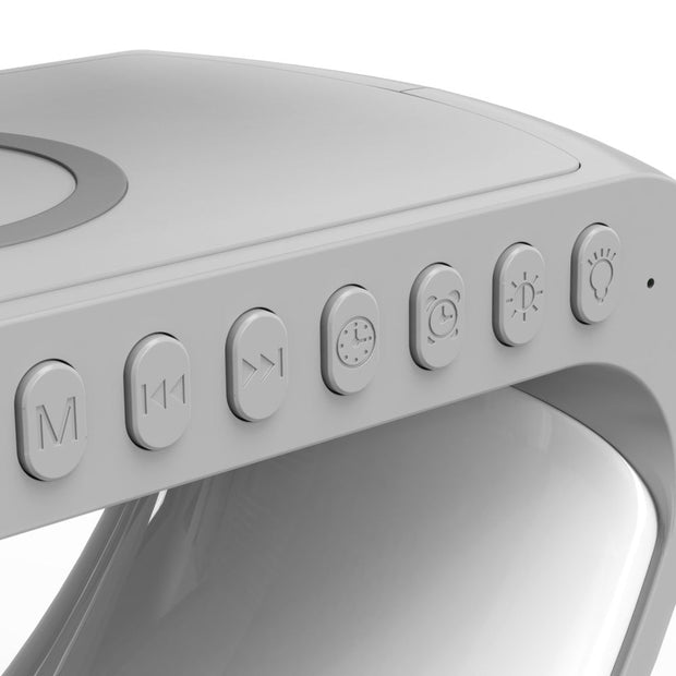3-in-1 ampulla bedside lamp with Bluetooth speaker and wireless charger, ideal for nightstands and home offices.

