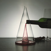 Elegant transparent wine decanter filled with red wine, used for decanting wine to enhance flavor and aroma.

